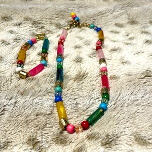 Multicolored beaded necklace and matching bracelet with gold closure